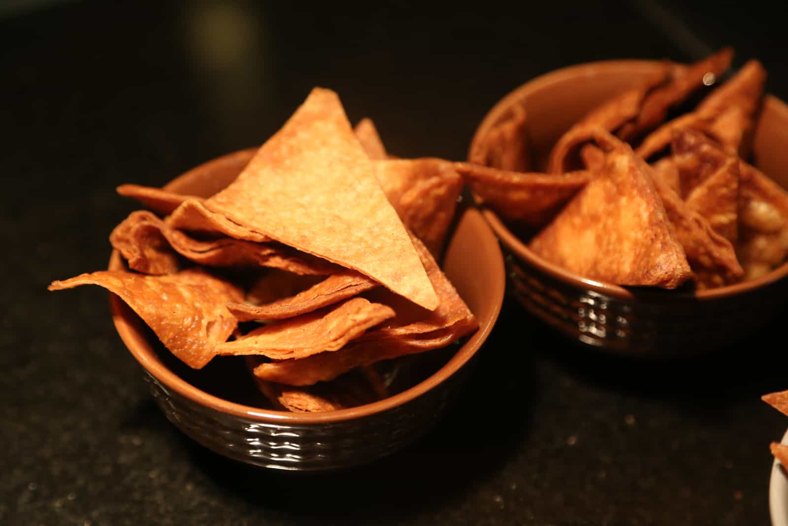 Doritos chips in brown bowls