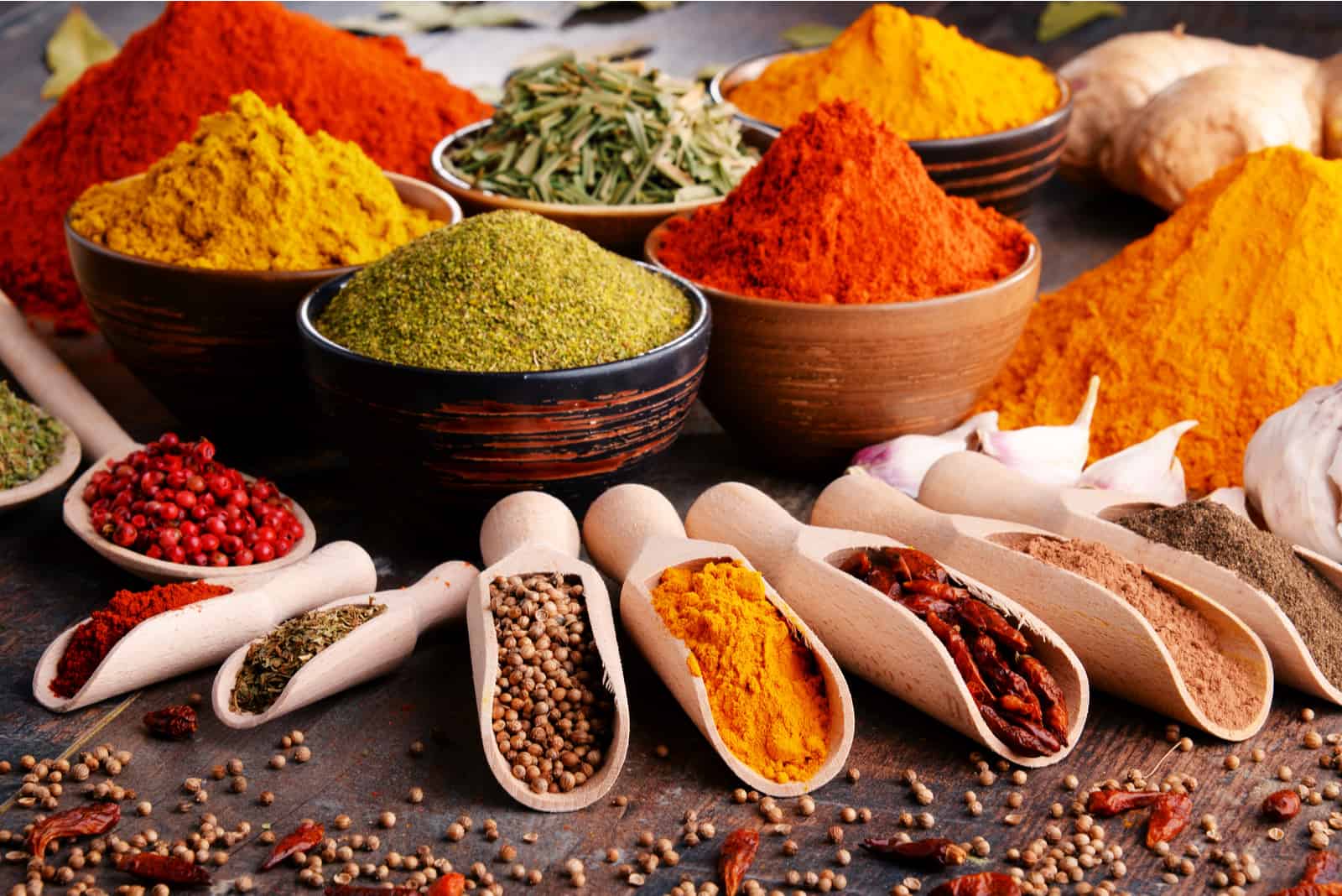 various kinds of spices in bowls on the table