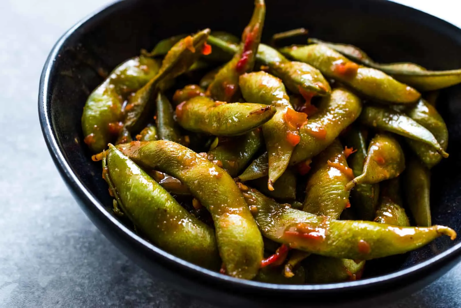 fried edamame in a pan