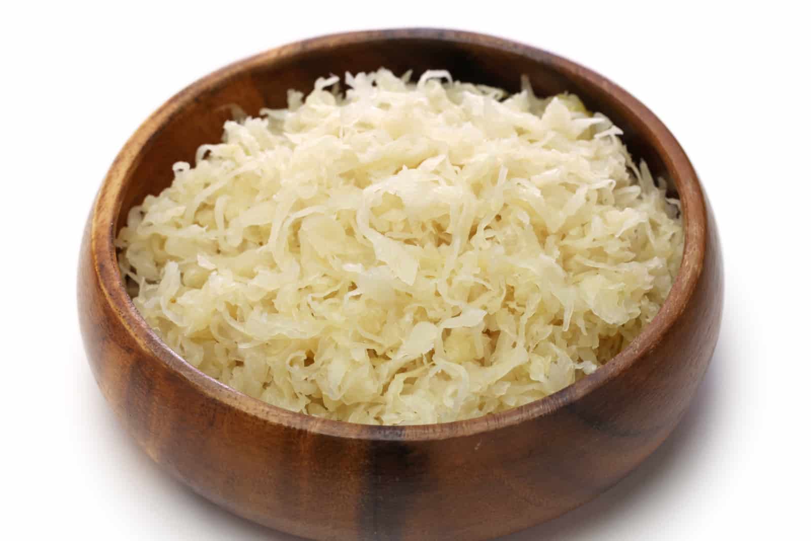 finely chopped sauerkraut in a wooden bowl