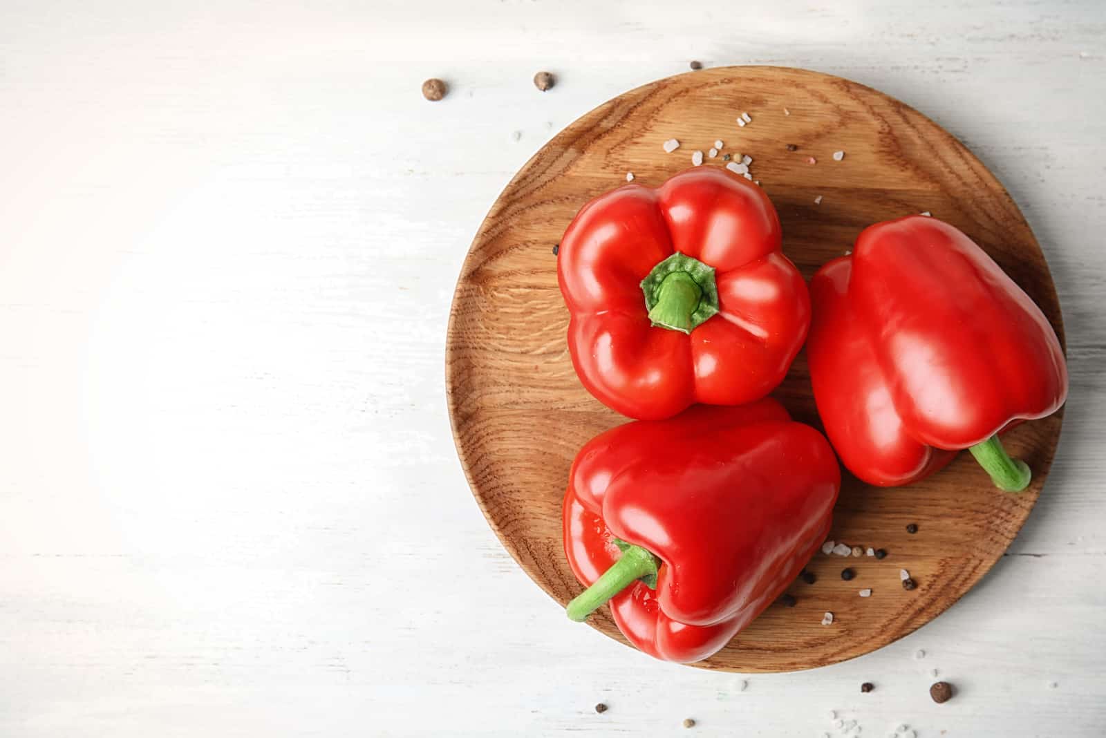 Plate with ripe paprika peppers