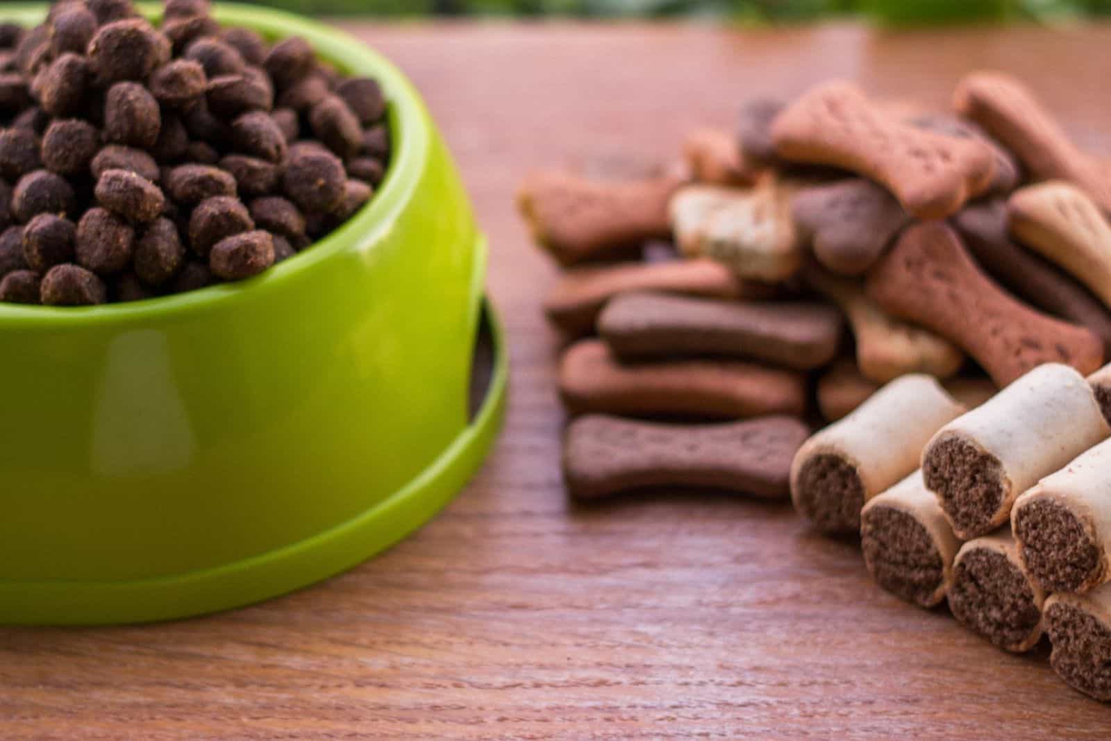 dog food and cookies on a wooden table