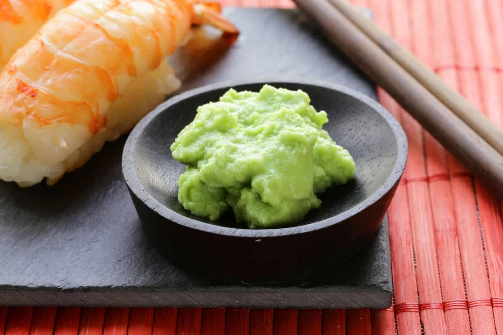 wasabi mustard sauce with a japanese food in the table