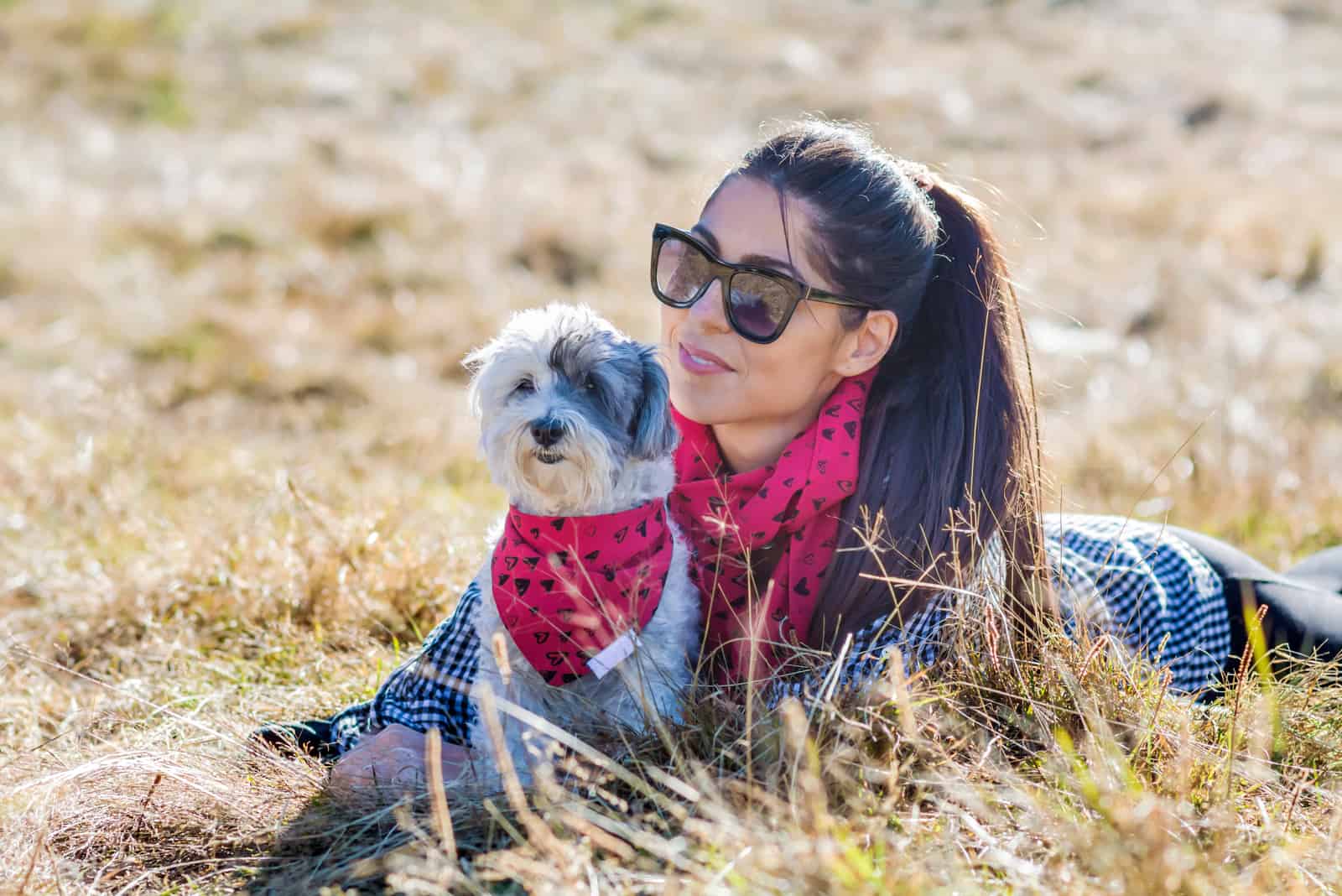 Woman hugging her cute havanese Dog