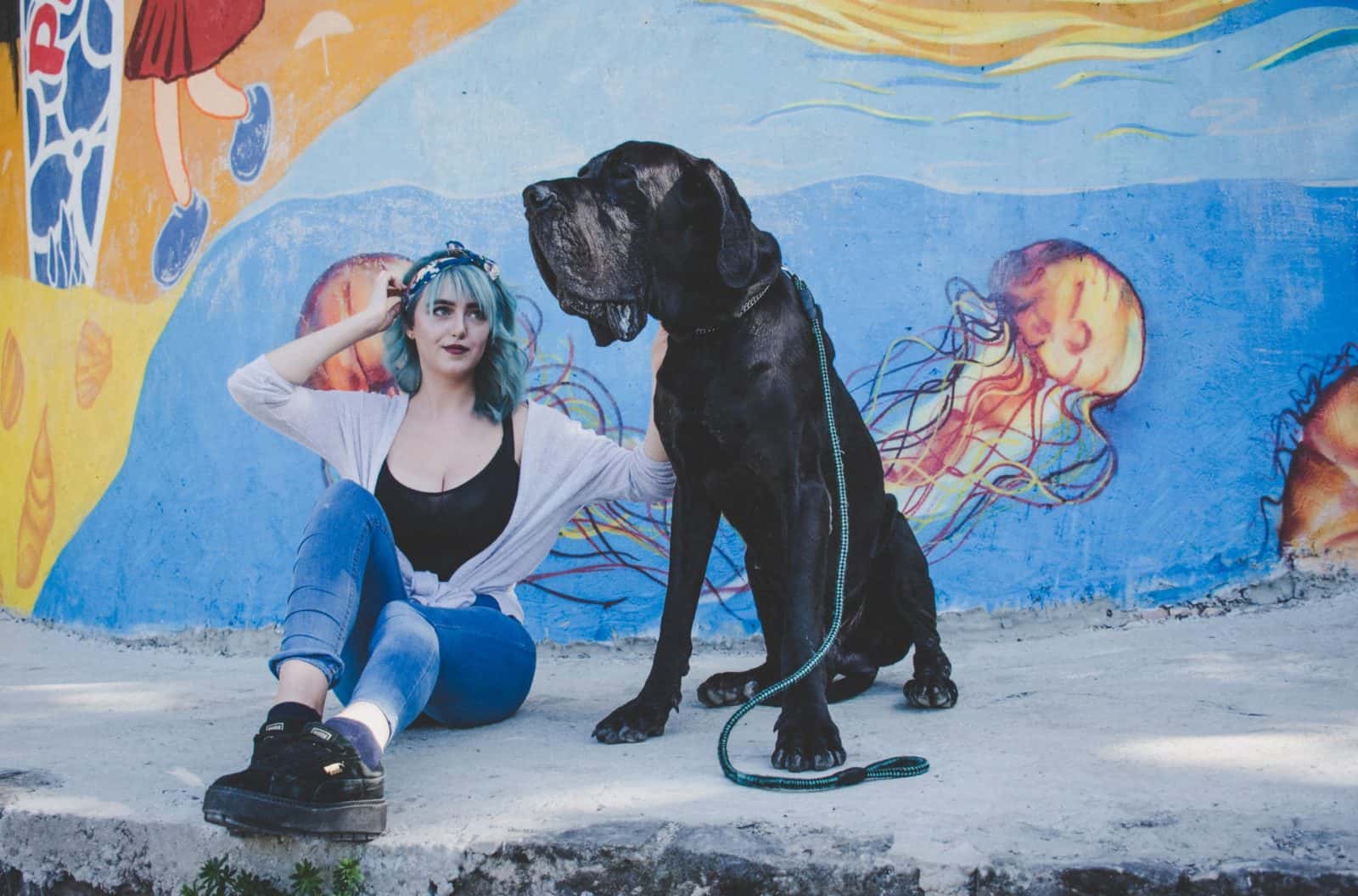 girl with her big black dog