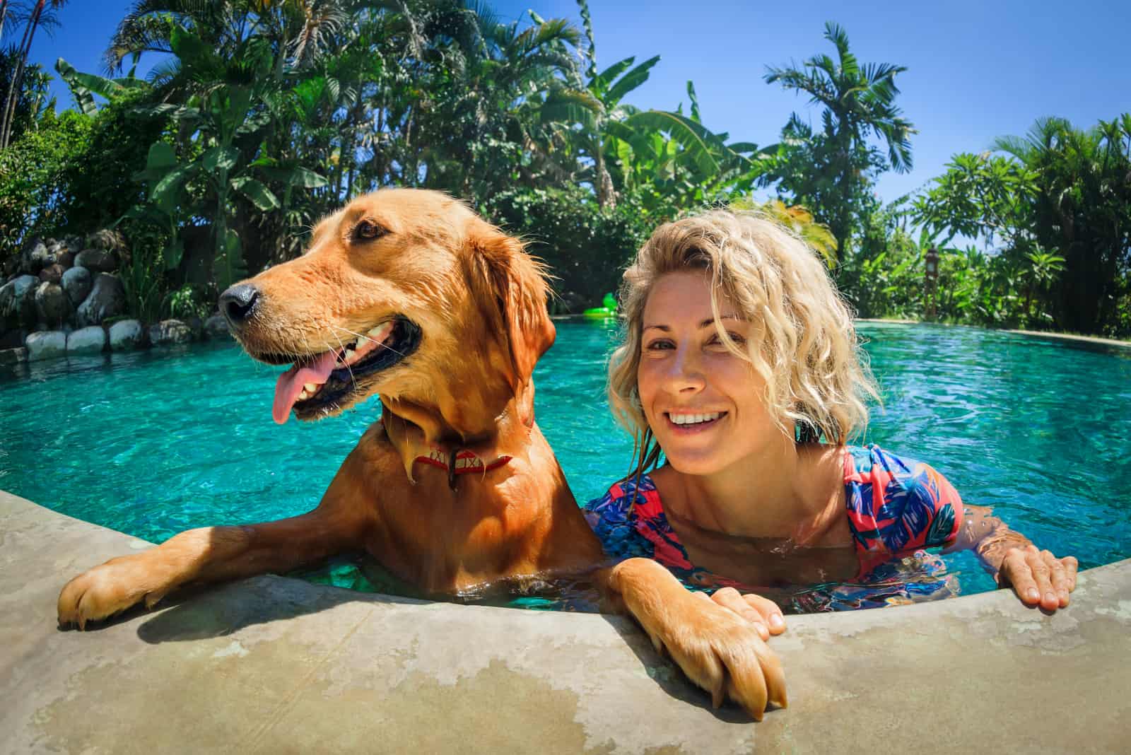 woman and dog in pool