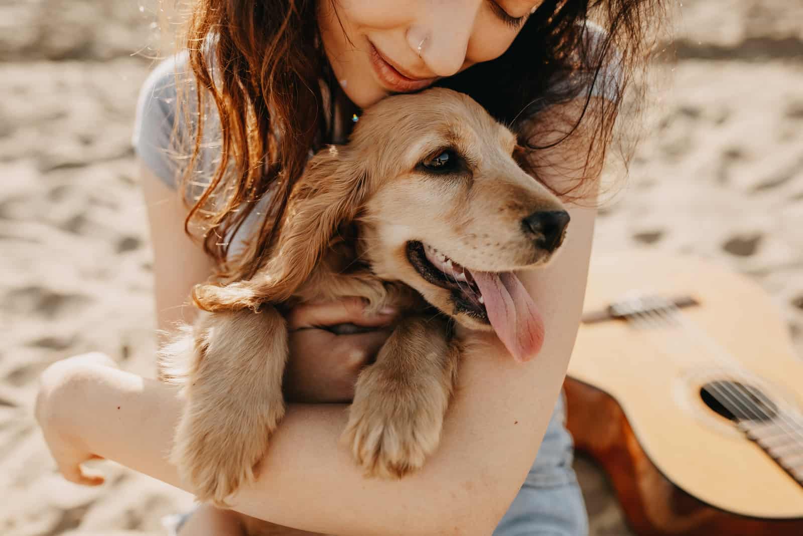 woman hugging her dog