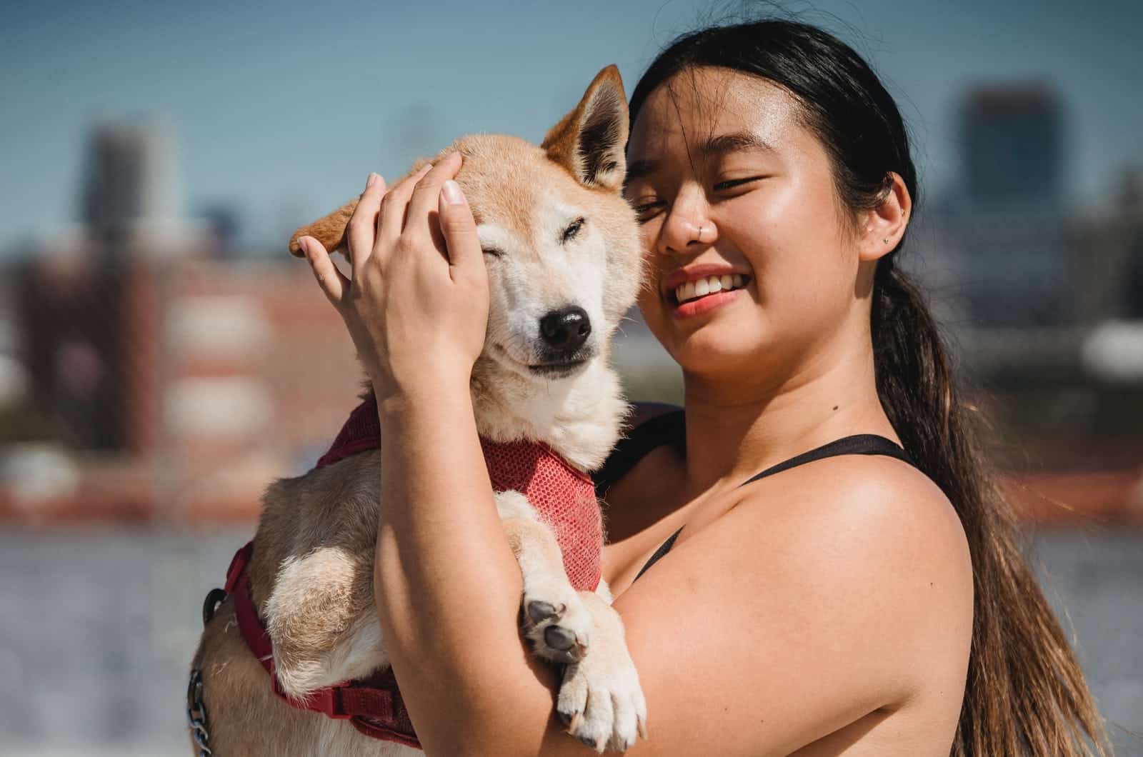 woman holding her dog