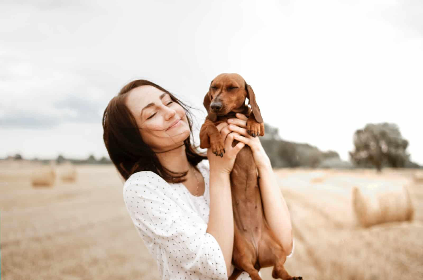 woman holding her dog