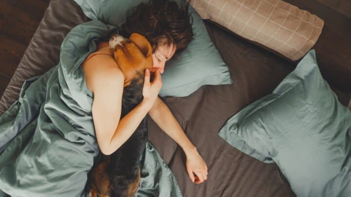 Why Does My Dog Sleep On My Head? 10 Reasons
