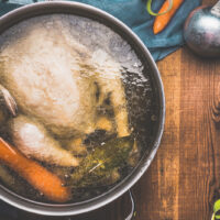 boiled chicken and veggies in boiling pot
