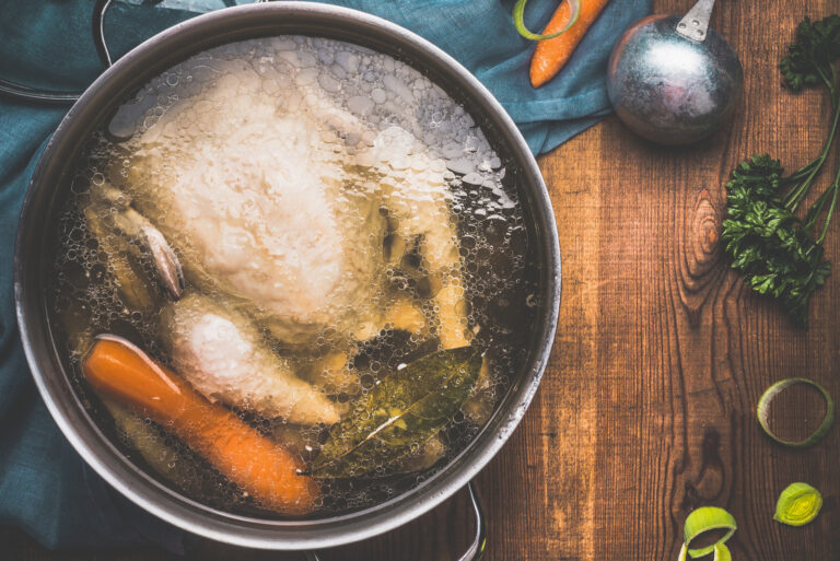 boiled chicken and veggies in boiling pot