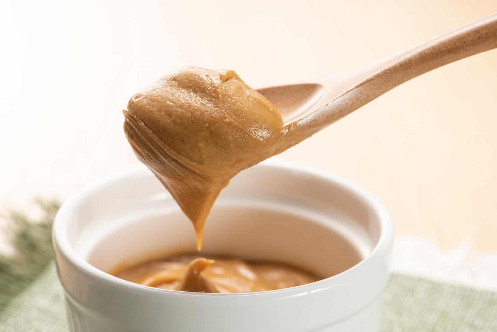 Peanut butter on wooden spoon