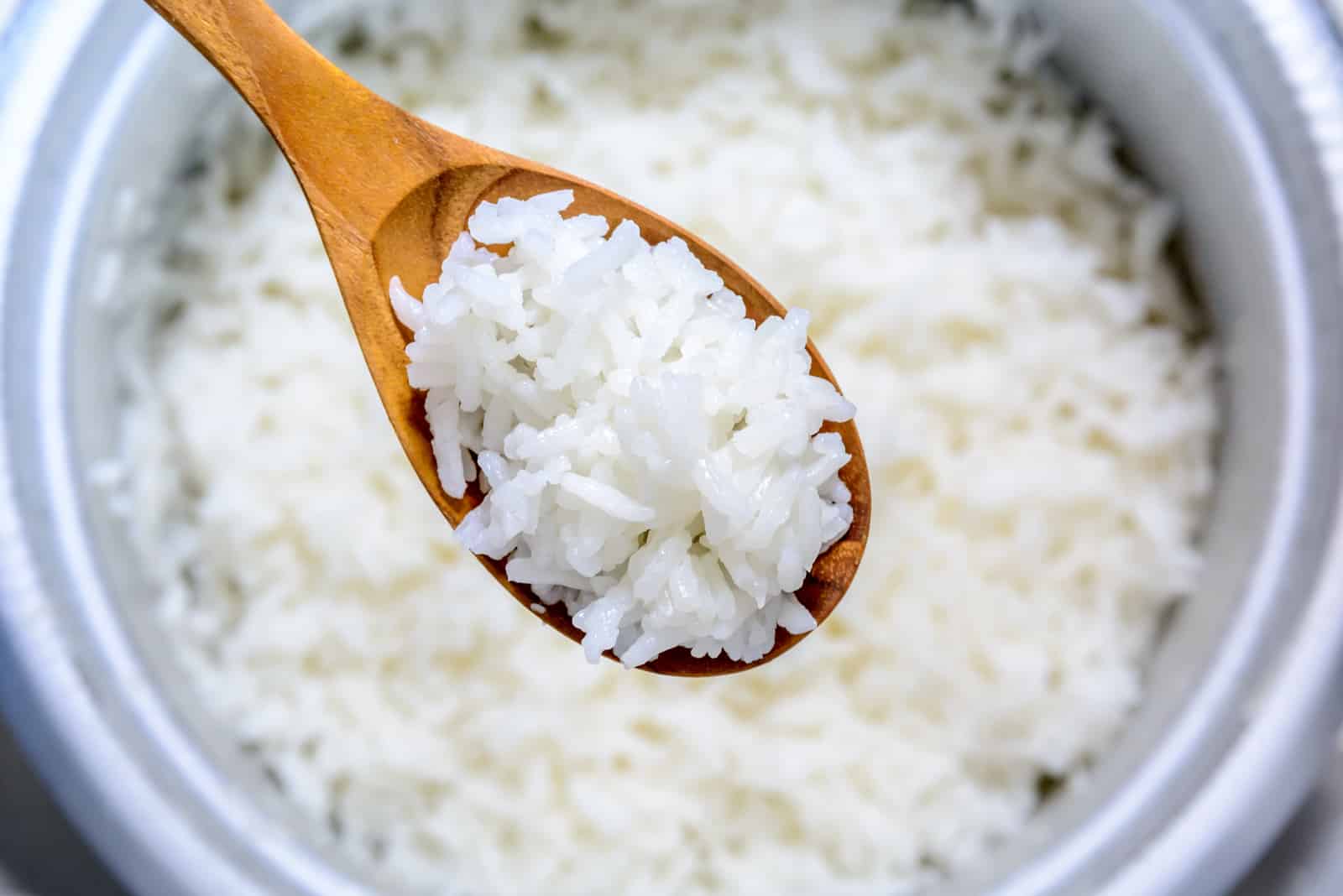 wooden spoon with Cooked Rice