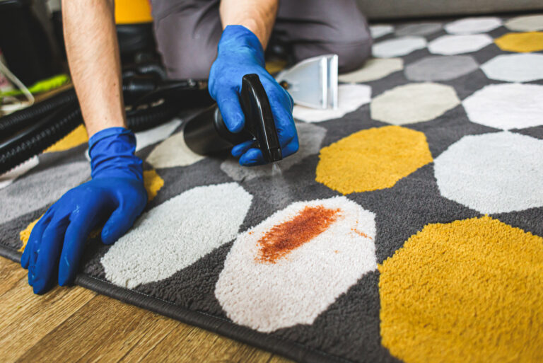 a man cleans the carpet