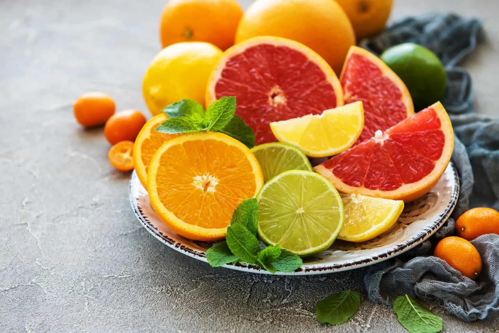 Plate with citrus fresh fruits