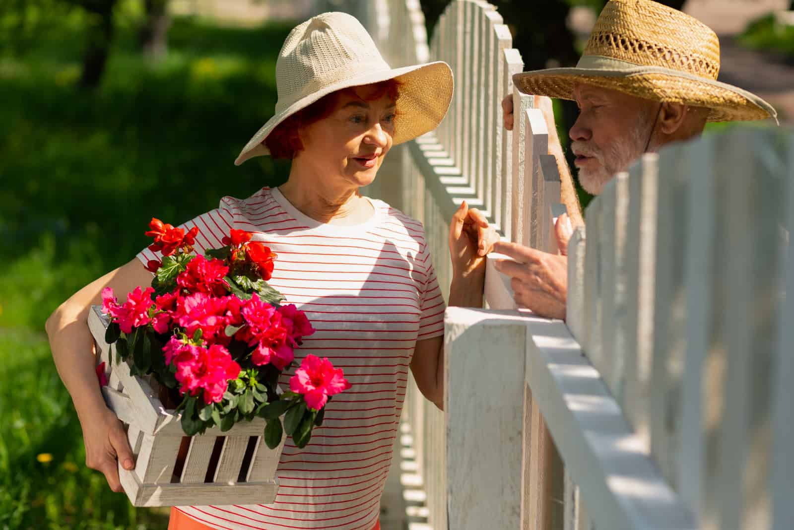 older woman talking to her male neighbor