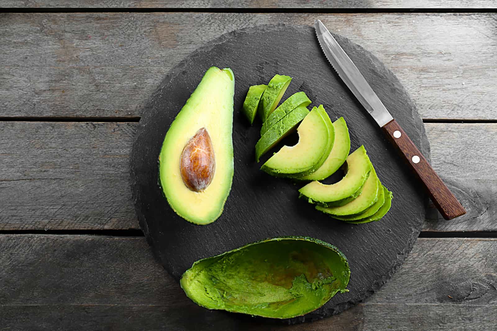 avocado slices on slate plate