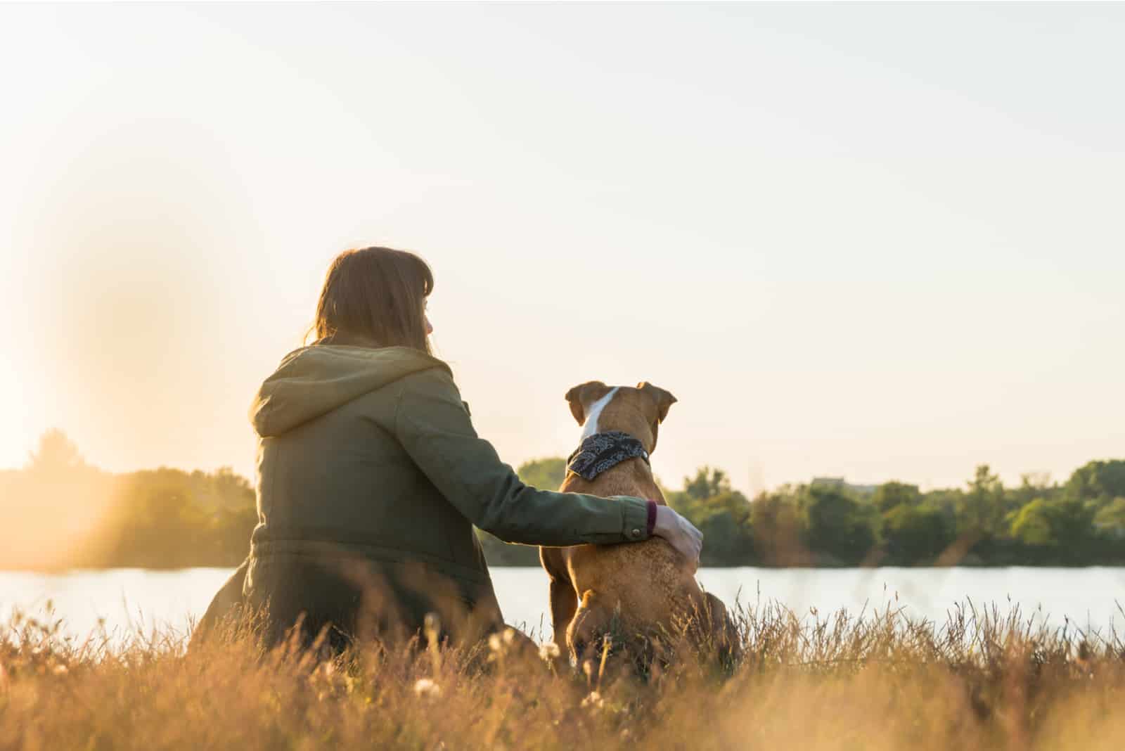 woman sitting outside with her dog