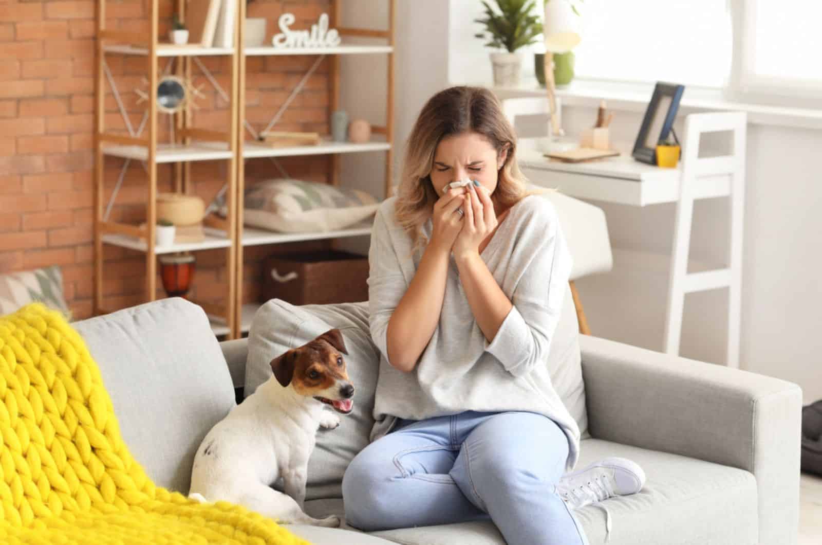 sick woman sitting beside a dog