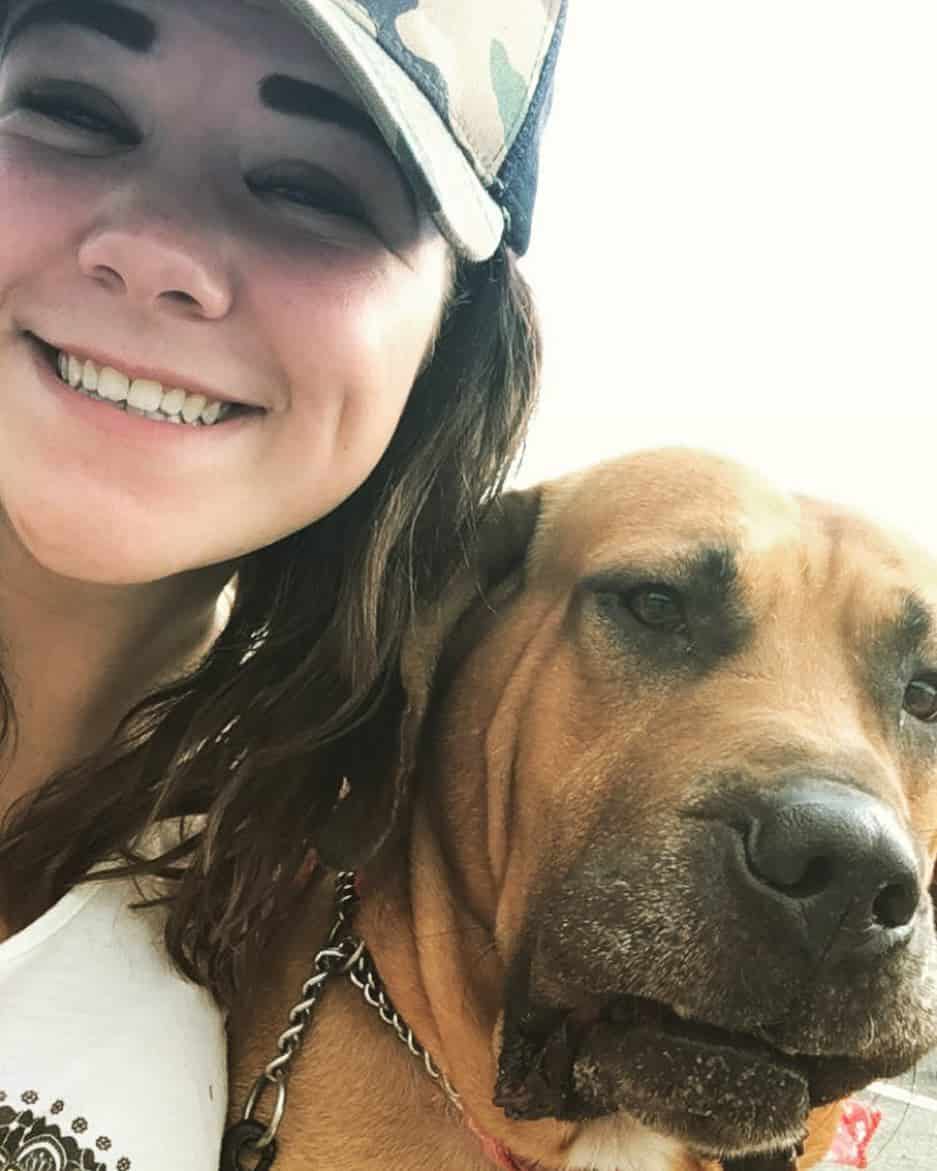 smiling girl with Bloodhound Pitbull Mix