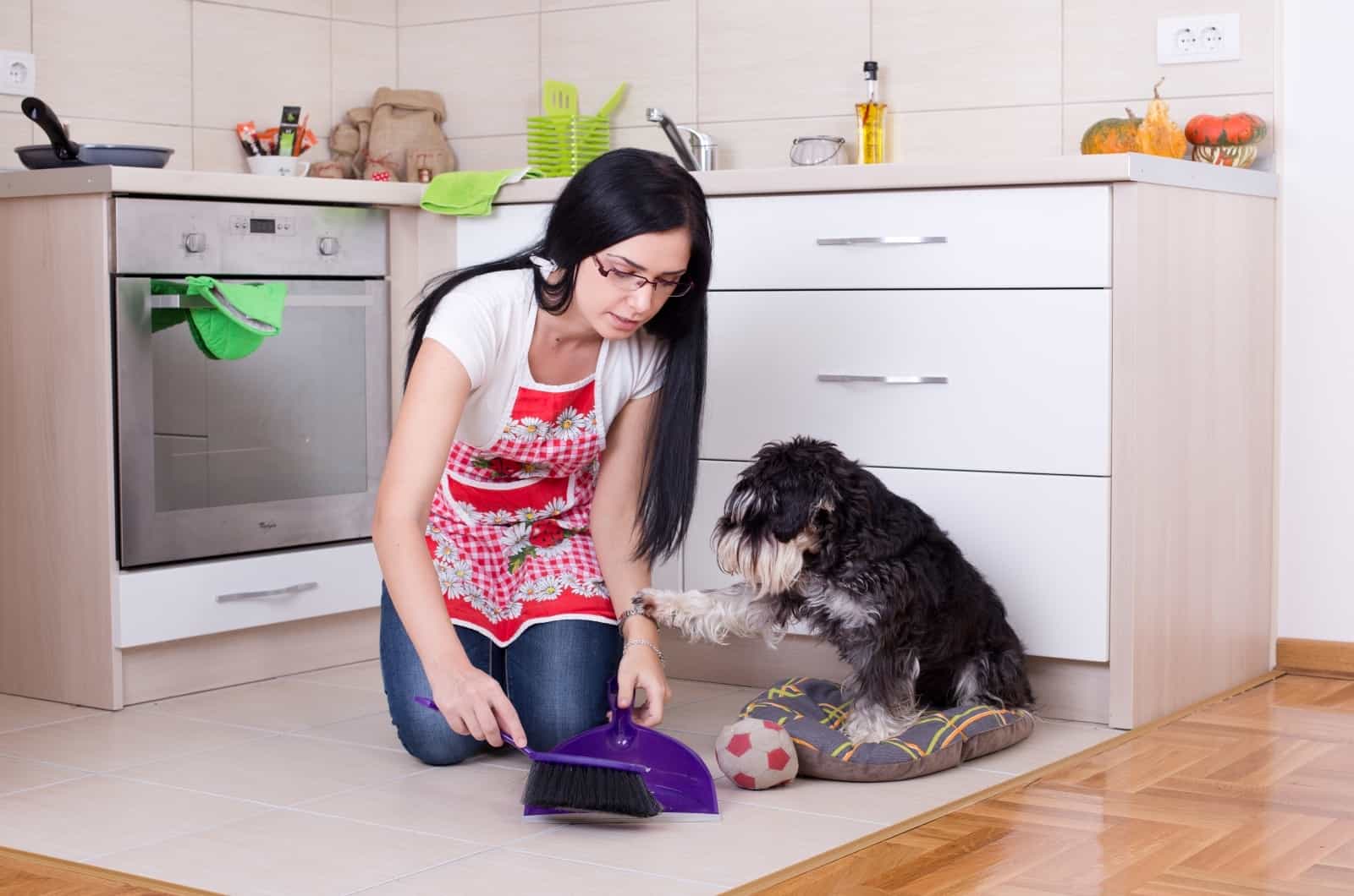 woman picking up after her dog