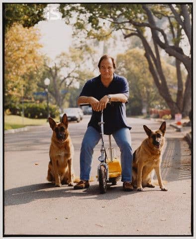 James Belushi on the street with German Shepherds