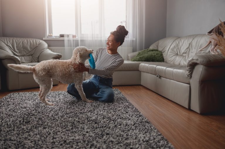 woman playing with her dog