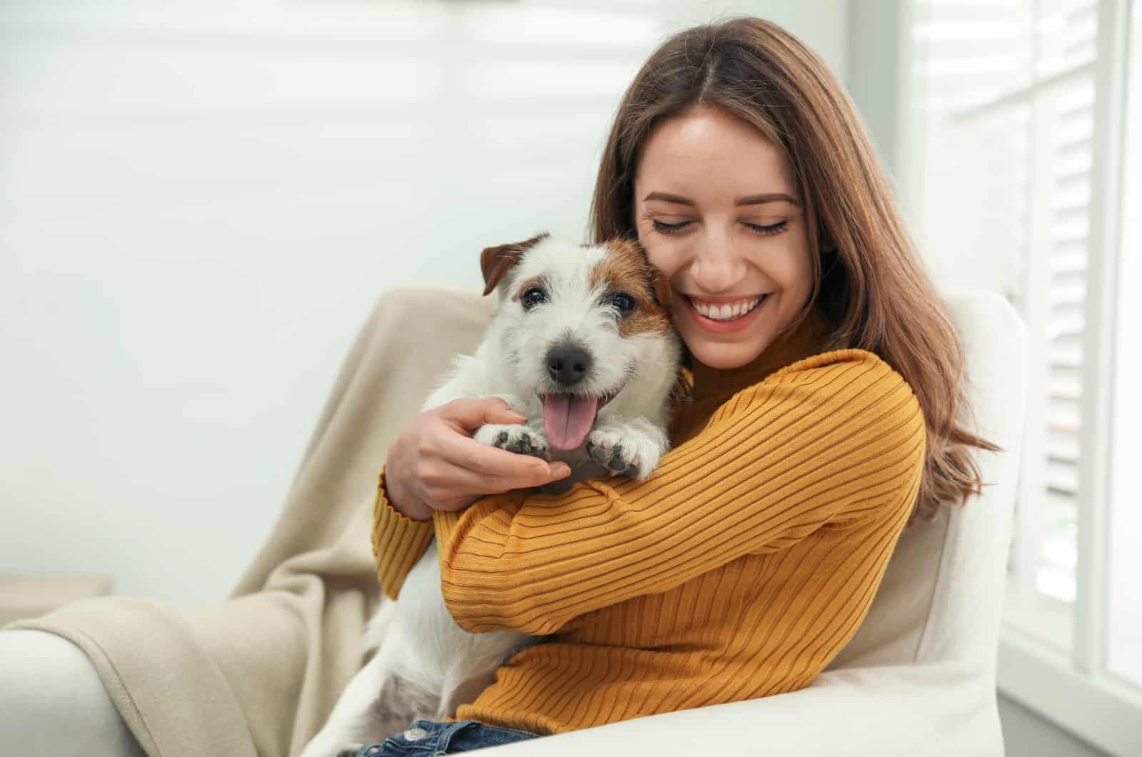 girl hugging her dog