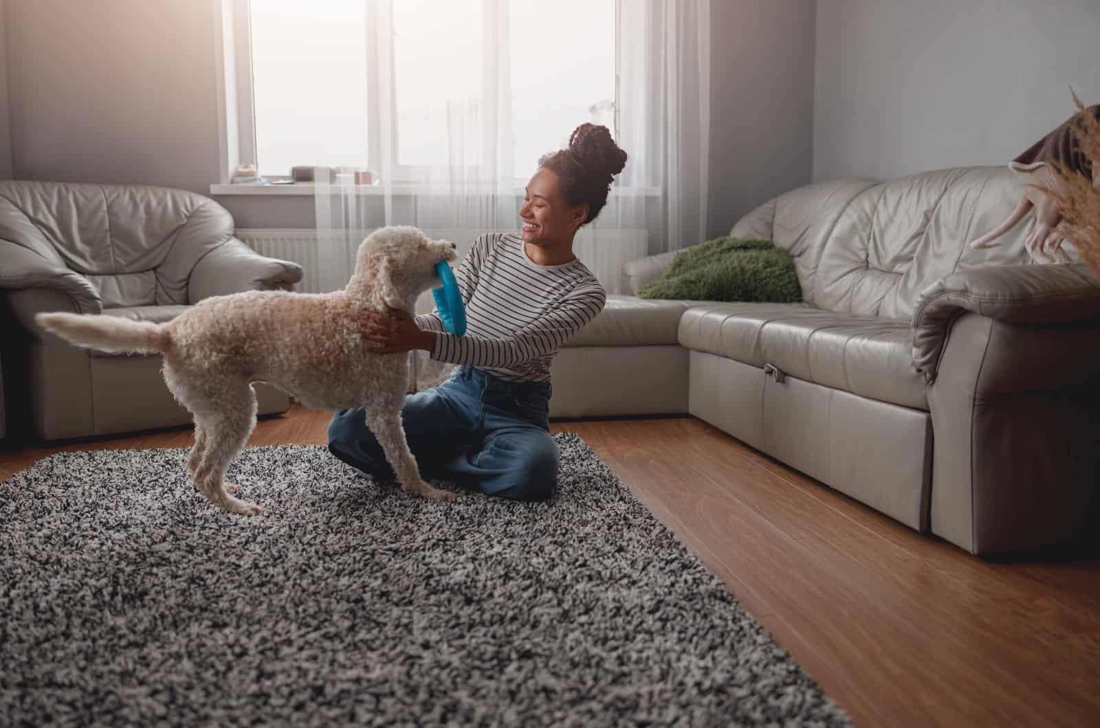 woman scratching dog