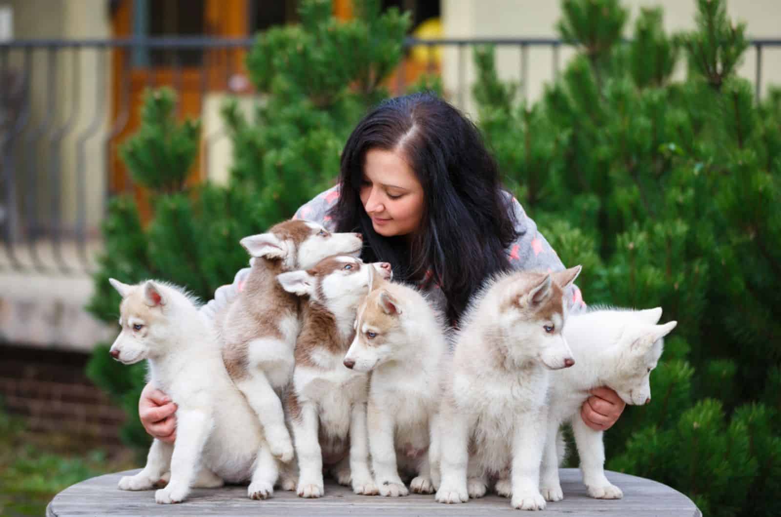 woman with her pets in a courtyard