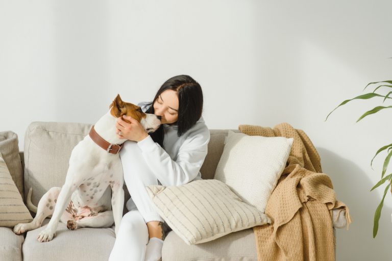 woman pets her dog