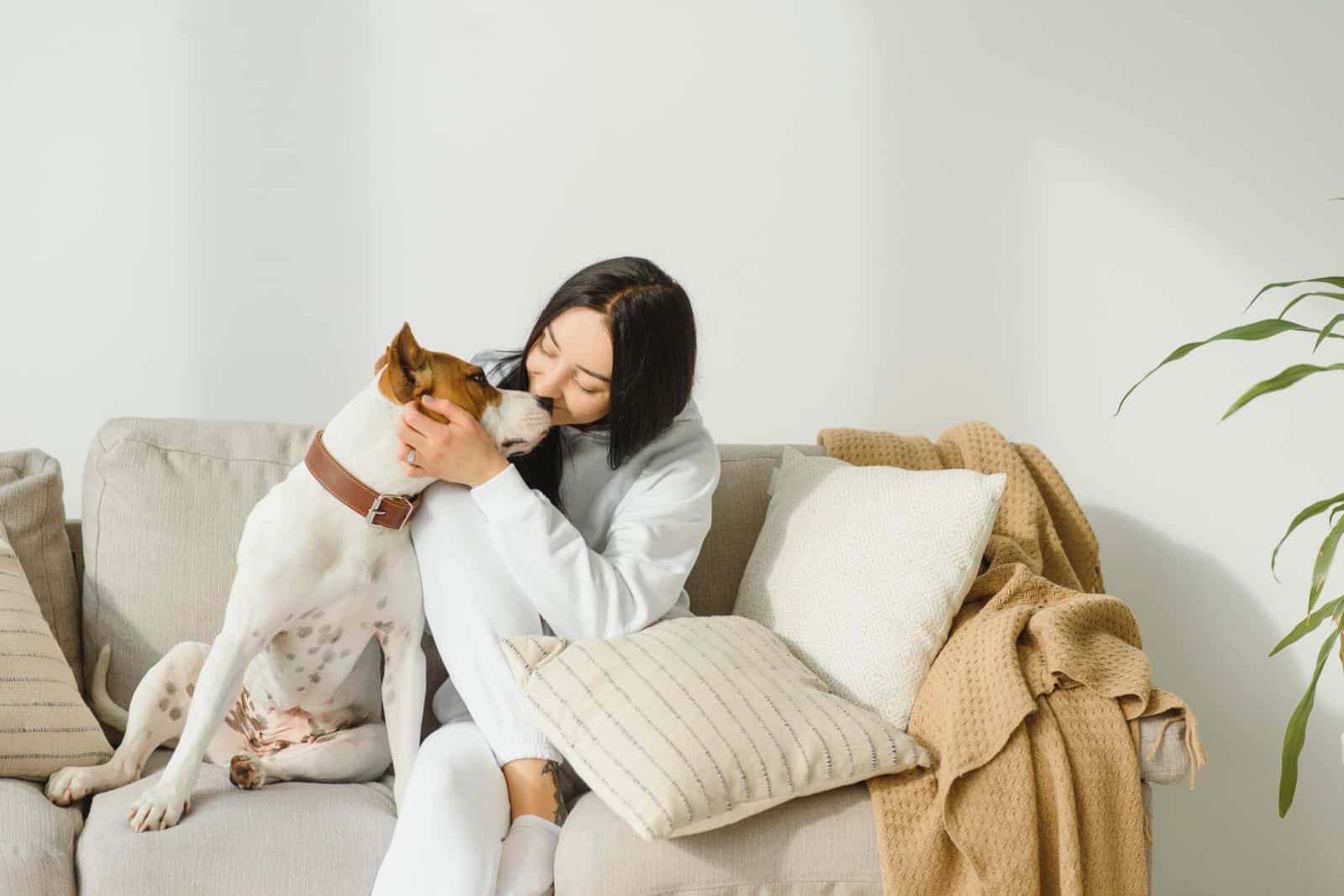 woman pets her dog