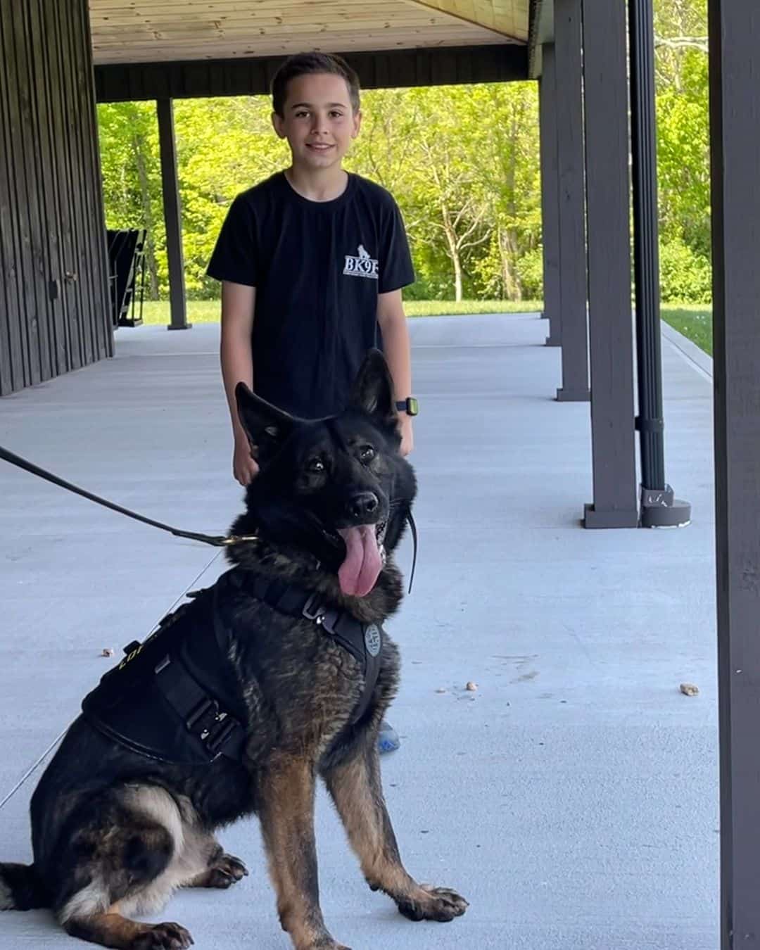 Brady photographed with a k9 dog