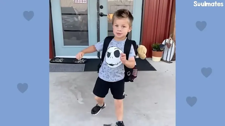 little boy with dog toy in his backpack