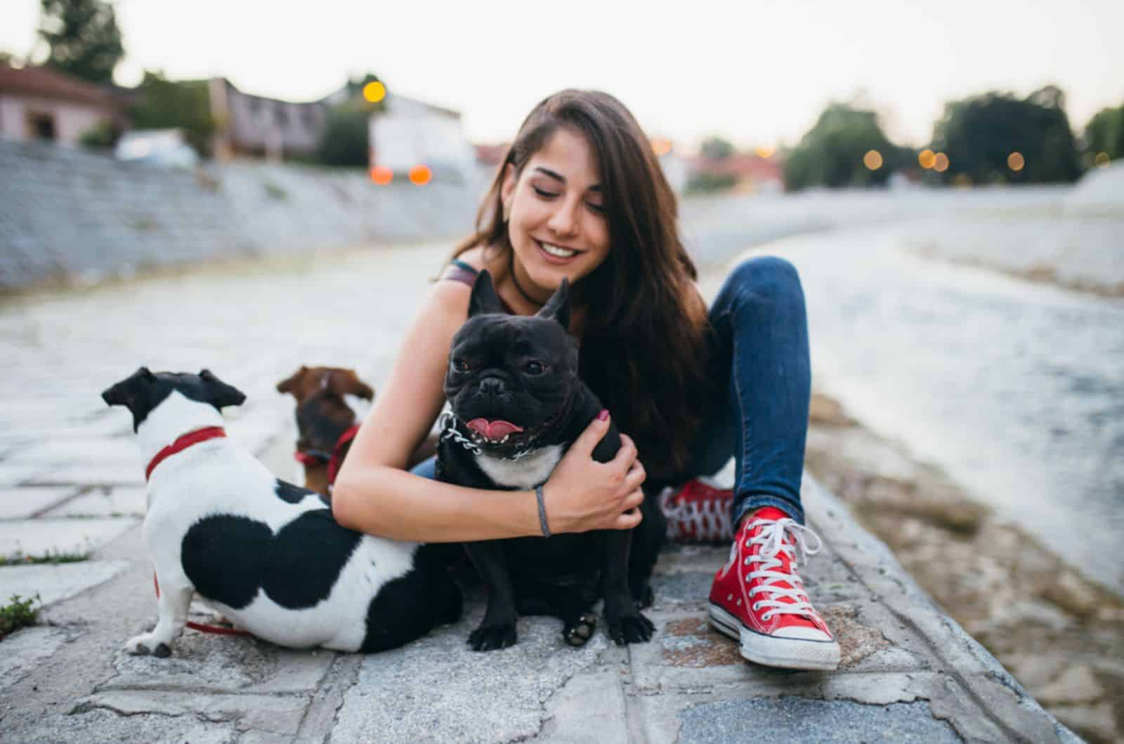 dog walker with dogs enjoying outdoors 