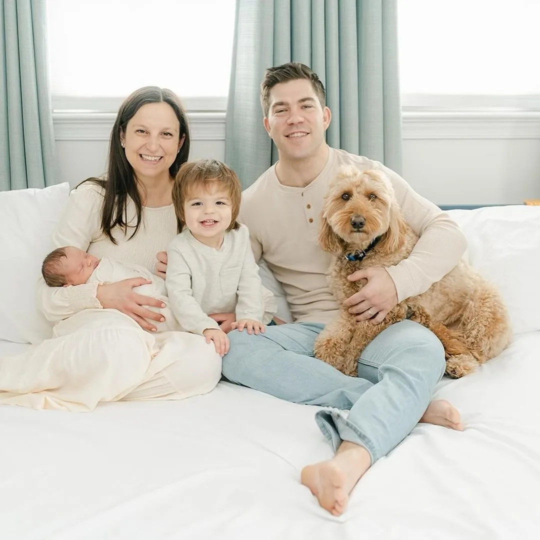 nice family with goldendoodle