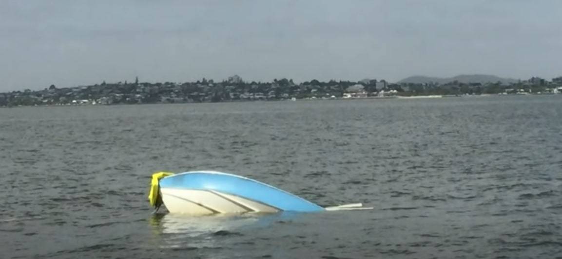 the boat sinks in the water