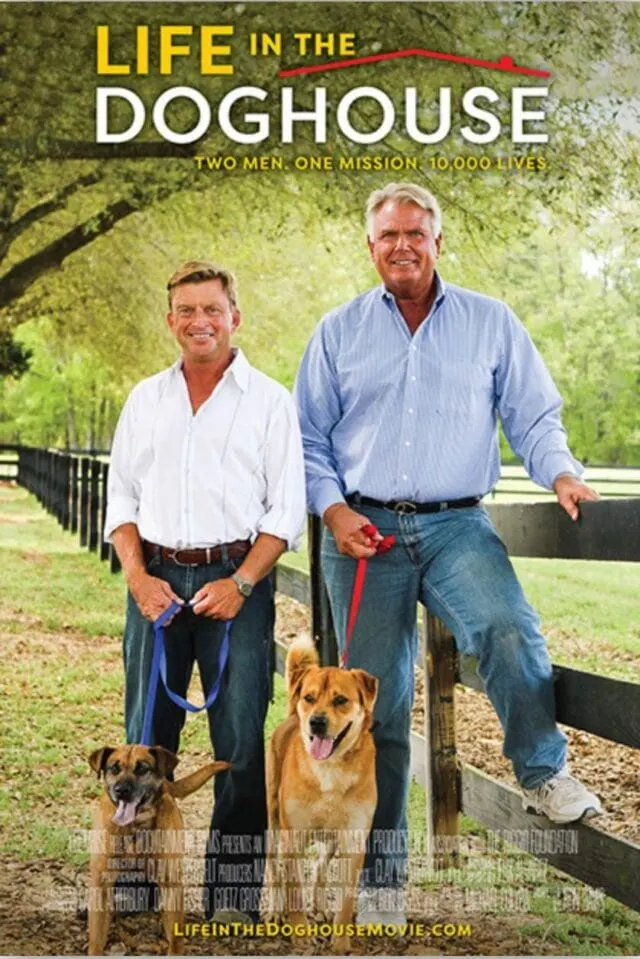 two men cover with dogs