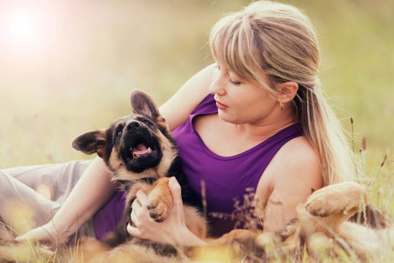 woman and German Shepherd puppy