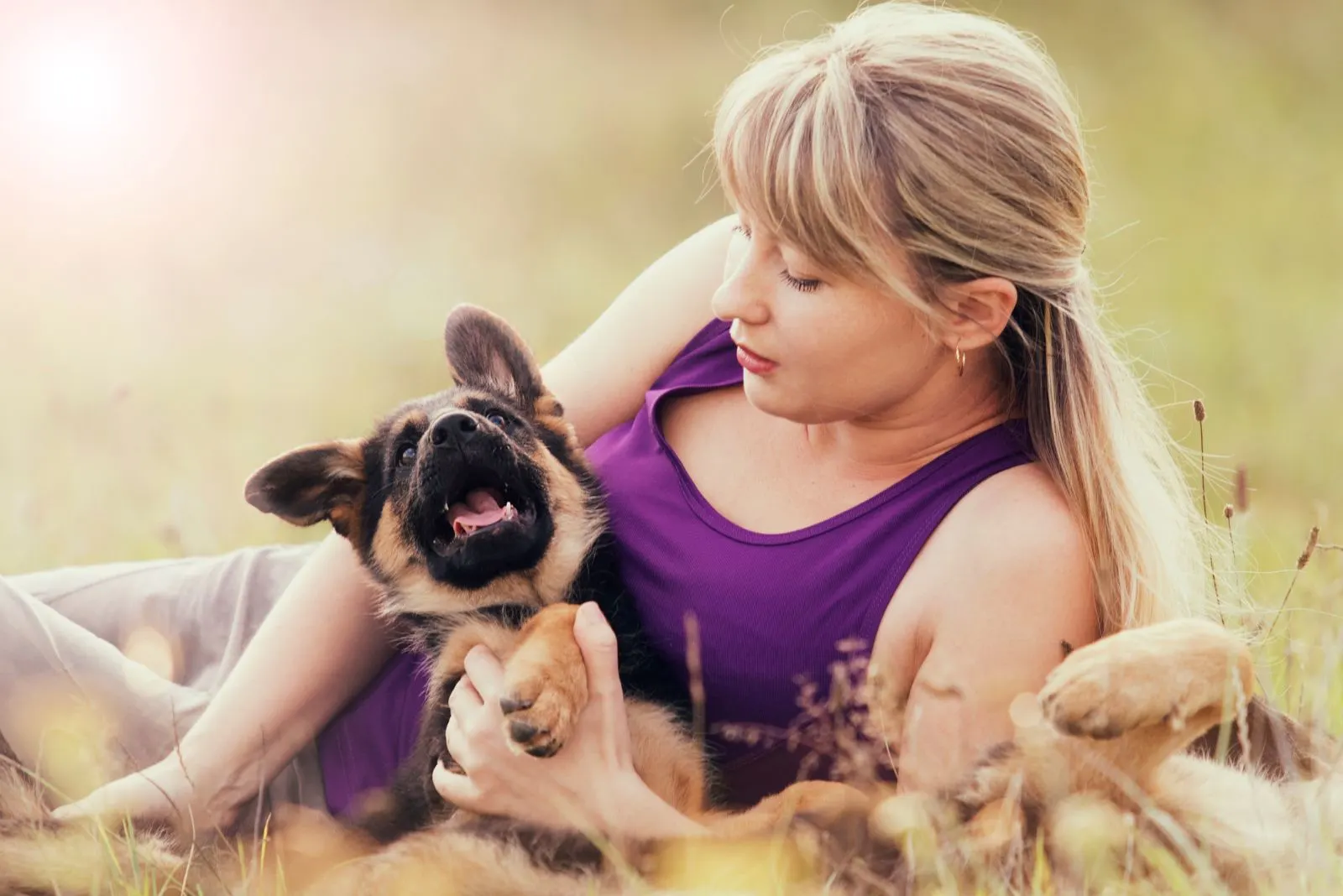 woman and German Shepherd puppy