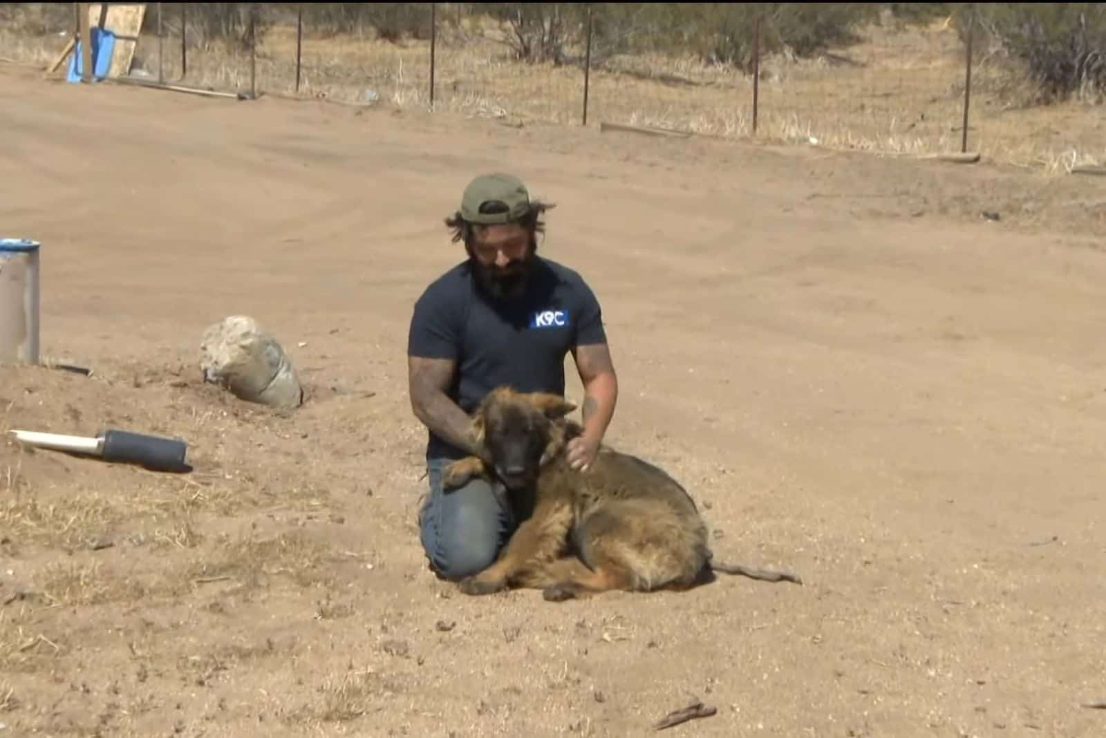 German shepherd trainer caresses