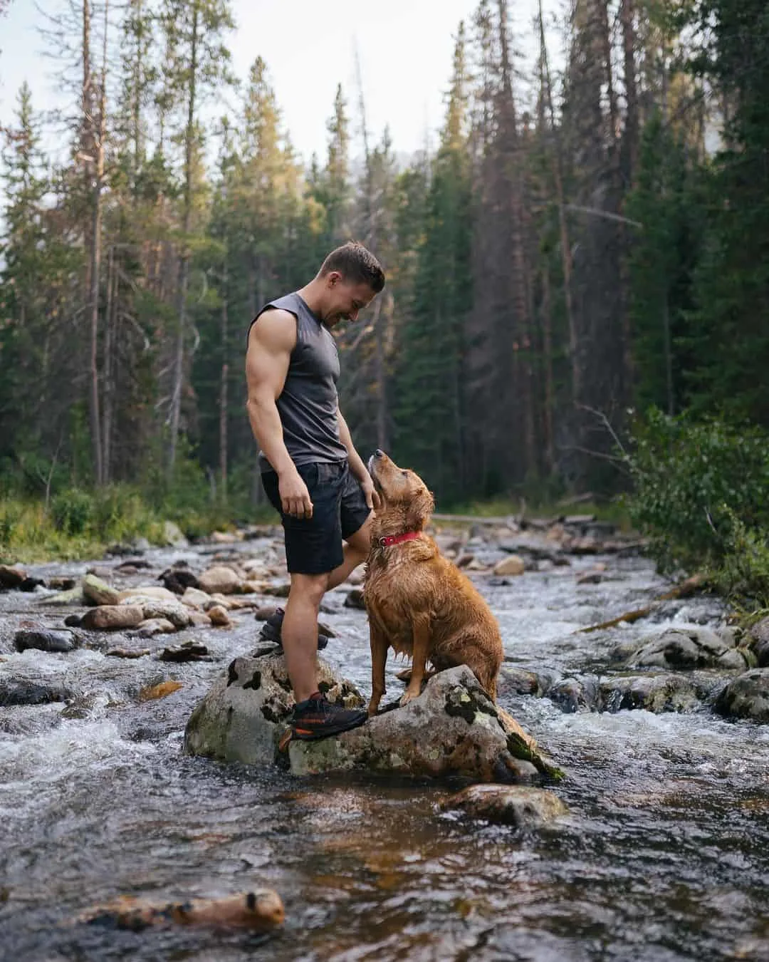 Man and dog on a hike, pursing new experience
