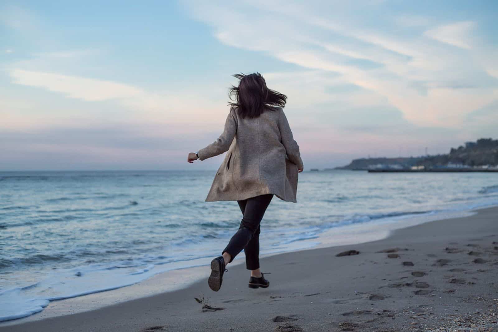 girl running on sea beach