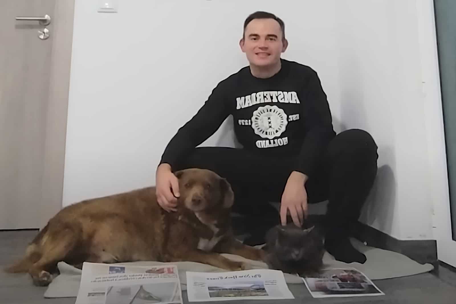 man posing with dog