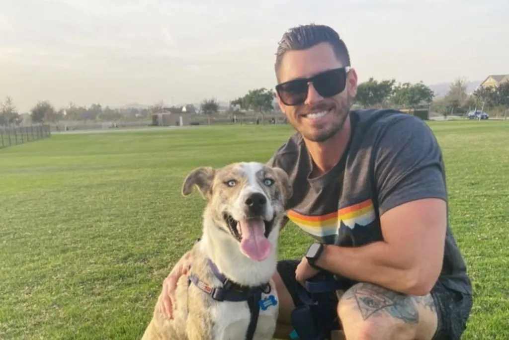 smiling man with dog