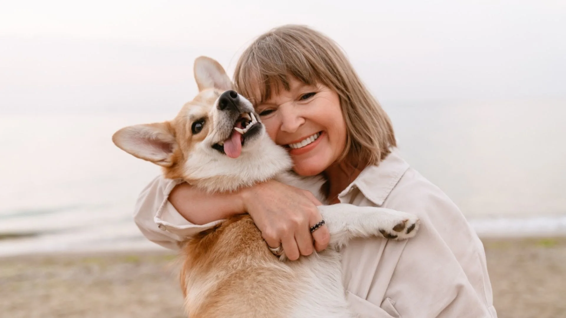 senior woman hugging her dog