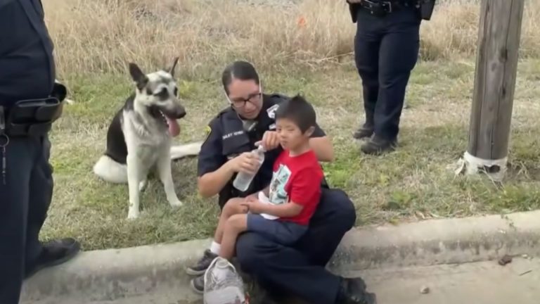 police woman with lost boy and a dog