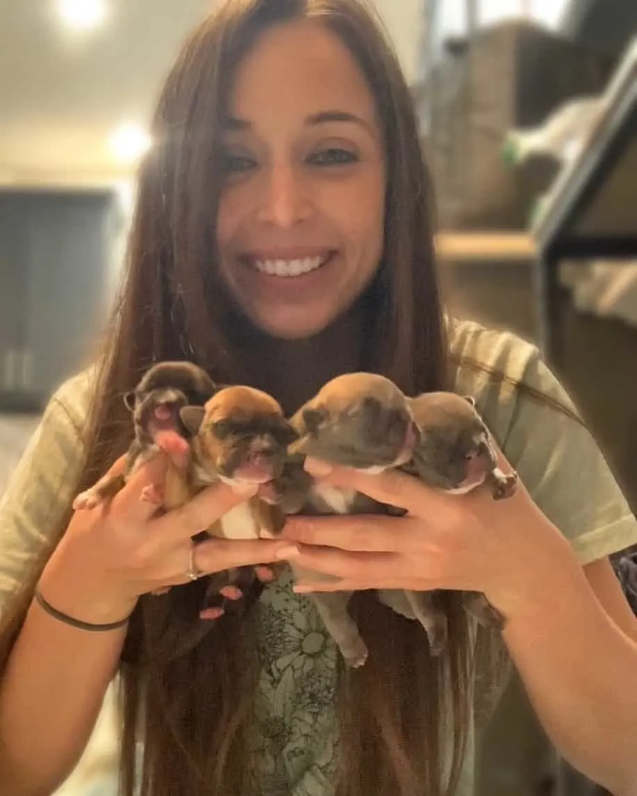 Kathryn holding puppies