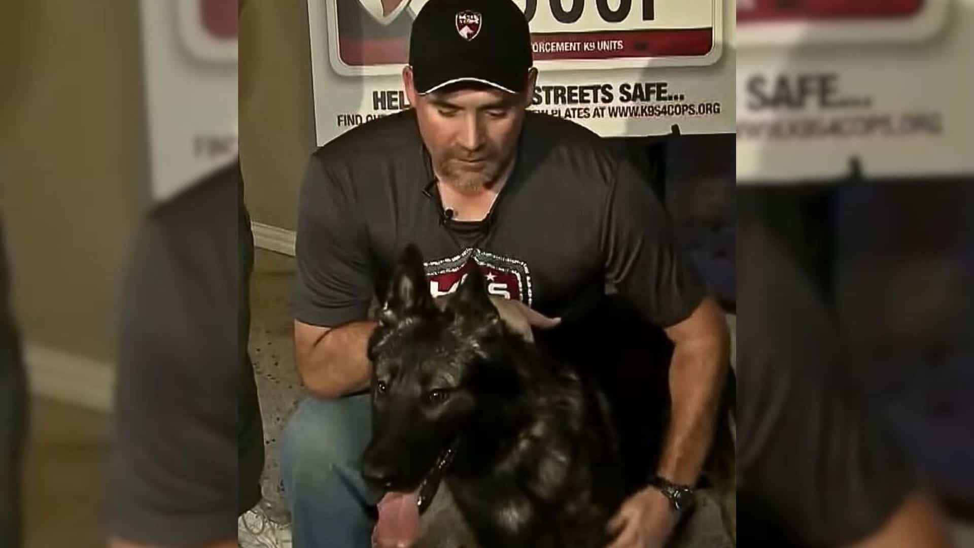 police officer embracing a dog